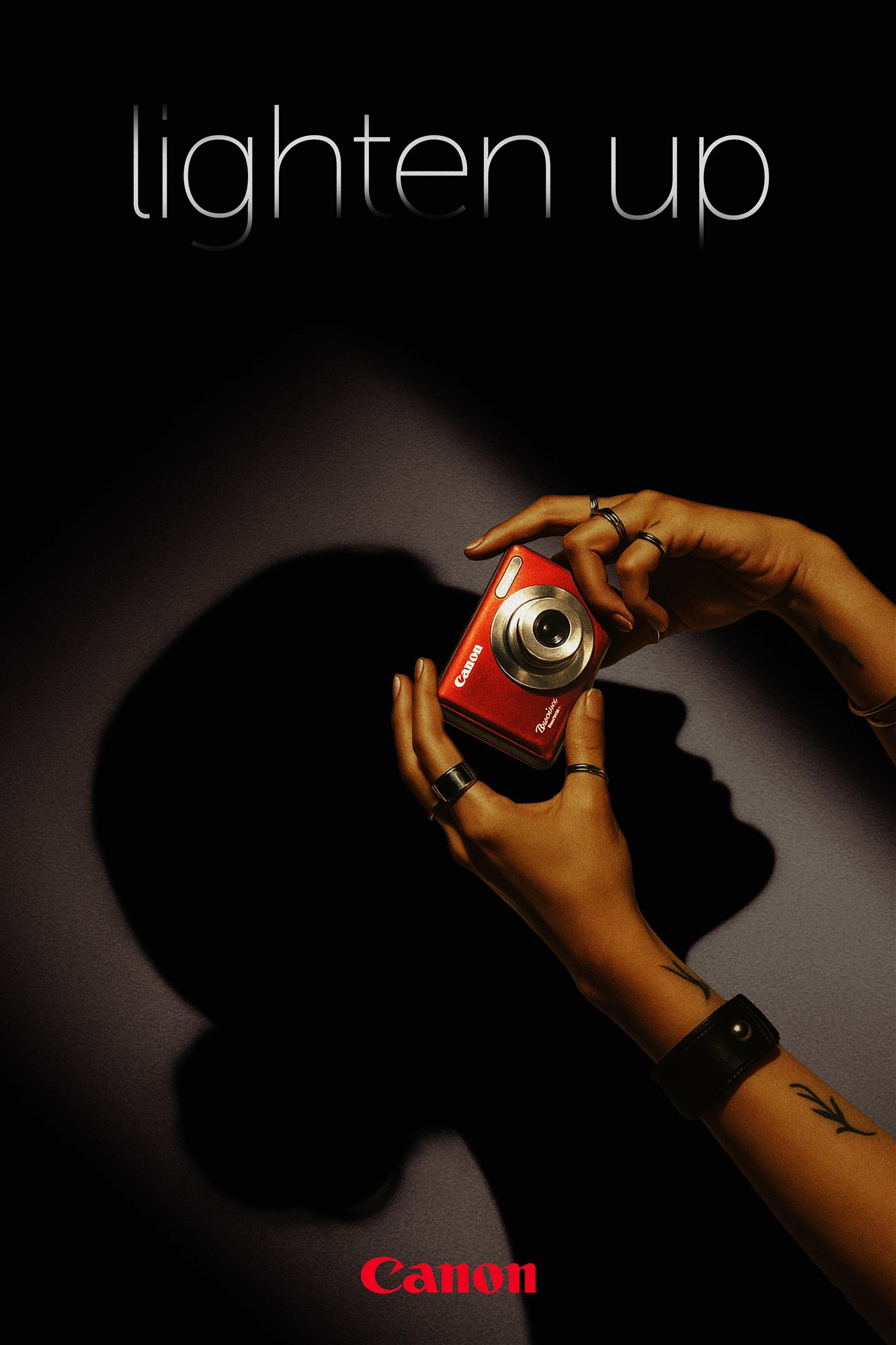 Lighten Up poster with a red Canon PowerShot.