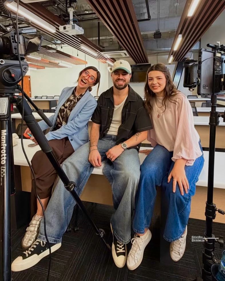 Emi with the Klap team on set in the university classroom.